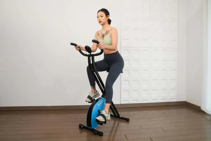 Foldable exercise bike with multiple resistance levels.